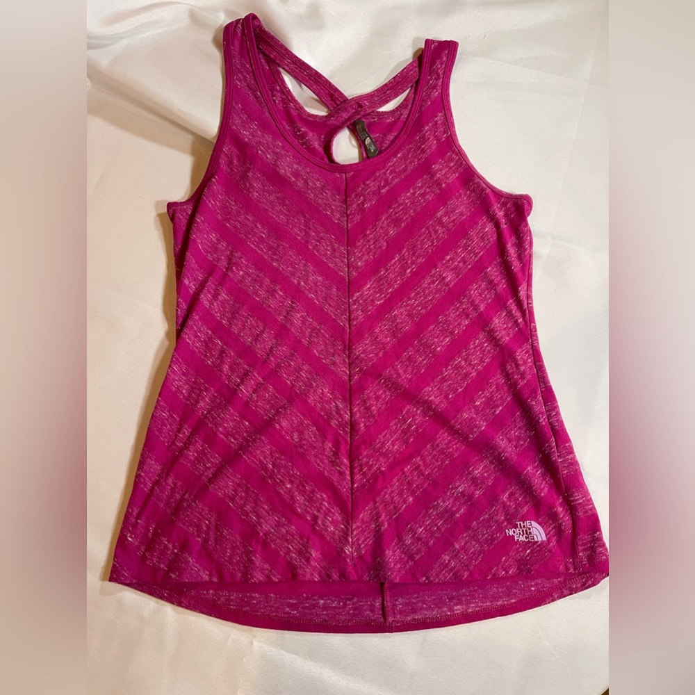 Gently worn. Women’s North Face magenta tank top, size medium.